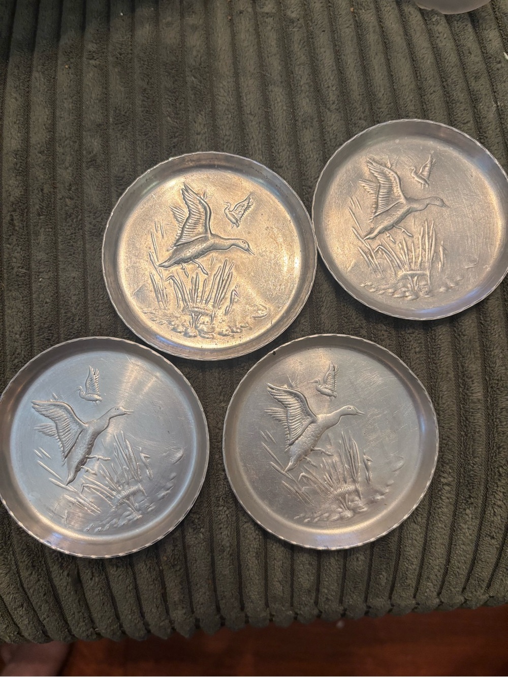 Set of 4 vintage aluminum coasters with mallard duck design